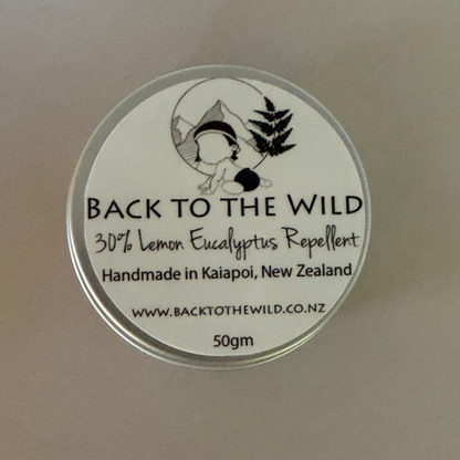 Round label with 'Back to the Wild' text and branding on a beige background